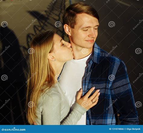 girl kissing boy neck